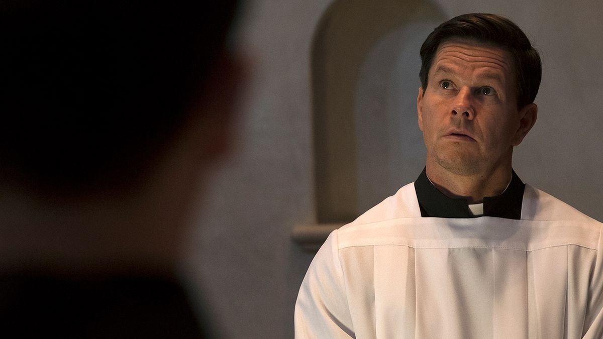 Mark Wahlberg dressed in his priests robes in Father Stu.