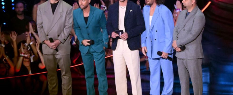 NEWARK, NEW JERSEY - SEPTEMBER 12: (L-R) Joey Fatone, Lance Bass, Justin Timberlake, JC Chasez and Chris Kirkpatrick of NSYNC speak onstage during the 2023 MTV Video Music Awards at Prudential Center on September 12, 2023 in Newark, New Jersey. (Photo by Noam Galai/Getty Images for MTV)