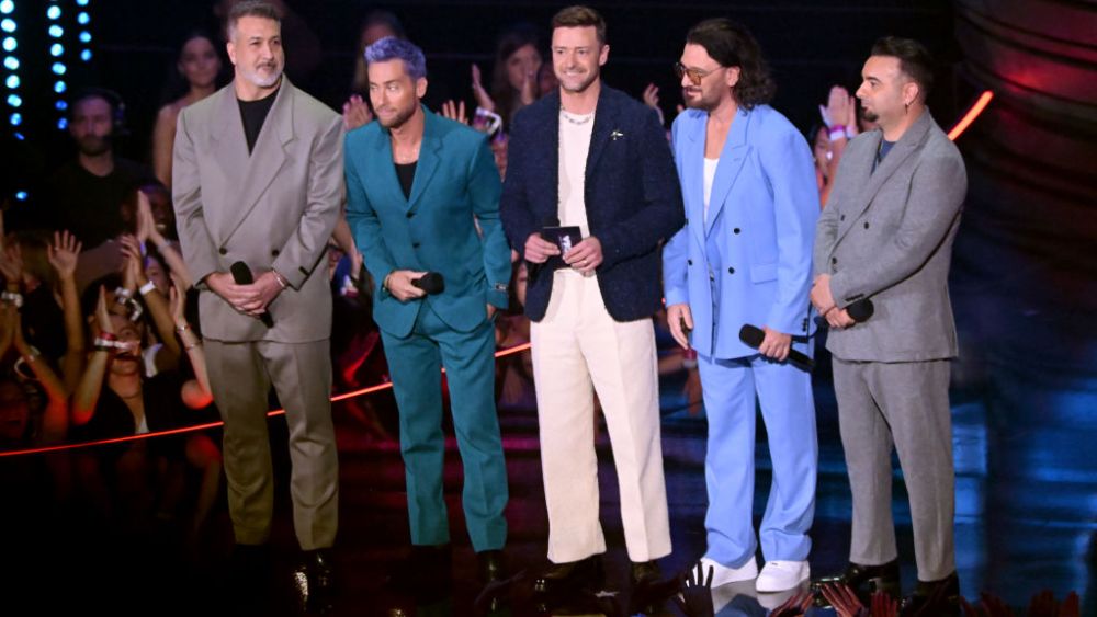 NEWARK, NEW JERSEY - SEPTEMBER 12: (L-R) Joey Fatone, Lance Bass, Justin Timberlake, JC Chasez and Chris Kirkpatrick of NSYNC speak onstage during the 2023 MTV Video Music Awards at Prudential Center on September 12, 2023 in Newark, New Jersey. (Photo by Noam Galai/Getty Images for MTV)