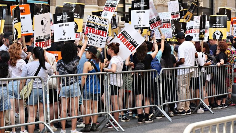 NEW YORK, NEW YORK - AUGUST 09: Members and supporters of the WGA and SAG-AFTRA picket on day 100 of the WGA strike outside Netflix and Warner Bros. on August 9, 2023 in New York City. The longest running writers' strike on record lasted 154 days in 1988. (Photo by Cindy Ord/Getty Images)