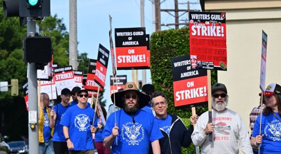 Writers walk the picket line on the second day of the television and movie writers' strike outside of Paramount Studios in Los Angeles, California on May 3, 2023. - More than 11,000 Hollywood television and movie writers went on their first strike in 15 years, after talks with studios and streamers over pay and working conditions failed to clinch a deal. The strike means late-night shows are expected to grind to a halt immediately, while television series and movies scheduled for release later this year and beyond could face major delays. (Photo by Frederic J. BROWN / AFP) (Photo by FREDERIC J. BROWN/AFP via Getty Images)