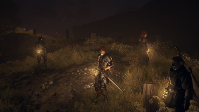 Pions dans Dragon's Dogma 2 la nuit utilisant des lanternes