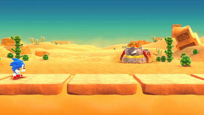 Sonic dans un niveau désertique avec un robot Eggman au loin