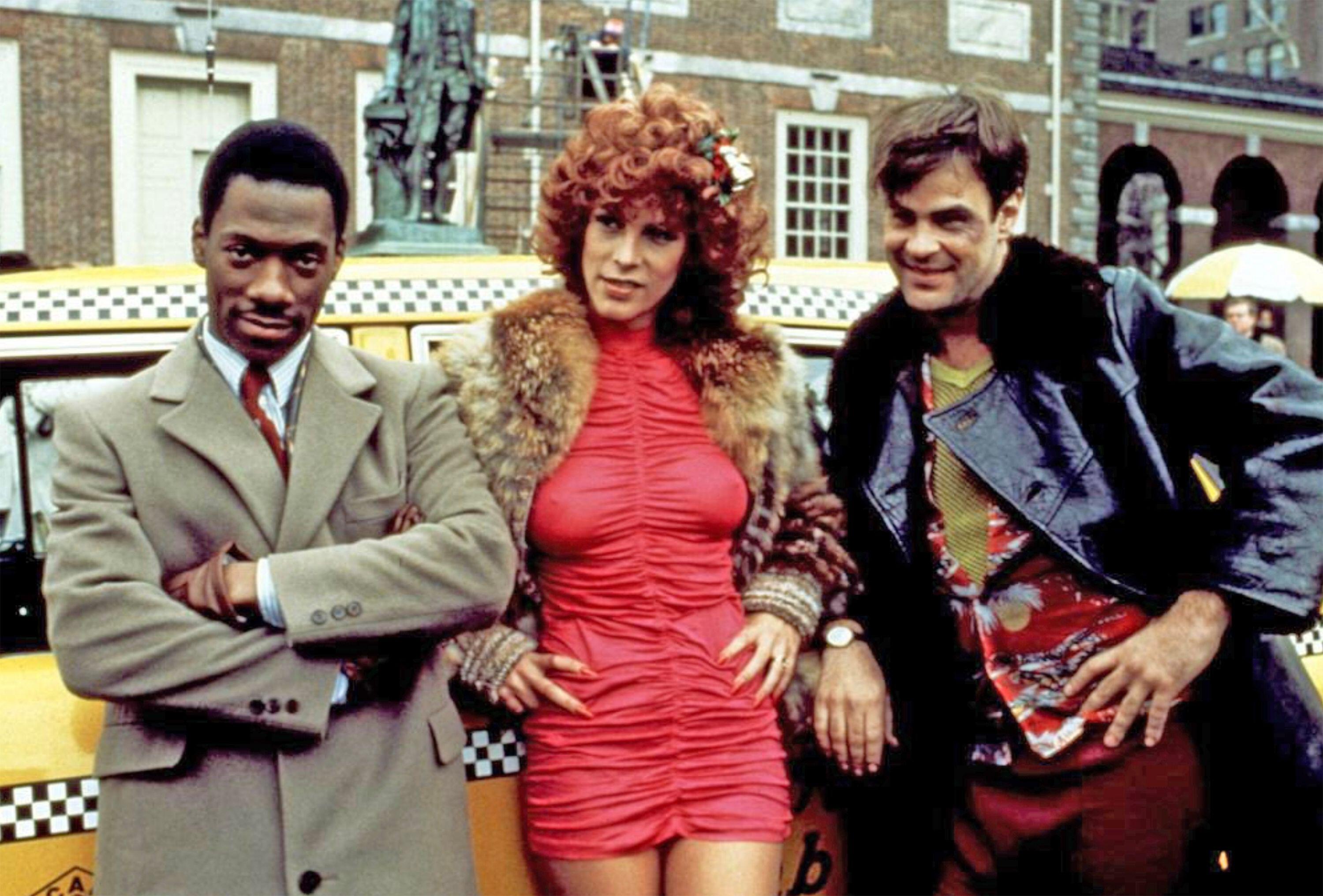 Jamie Lee Curtis avec Dan Akroyd et Eddie Murphy dans Trading Places