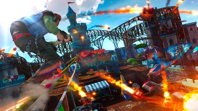 Il s'agit d'une capture d'écran typiquement chargée de Sunset Overdrive, mettant en vedette un héros punk grinçant autour d'une montagne russe appelée Demon Slayer, tandis que beaucoup de choses explosent.