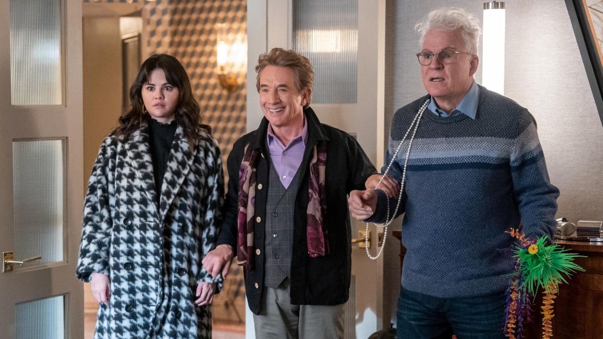 From right to left: Selena Gomez, Martin Short and Steve Martin all looking shocked in a press photo from Only Murders in the Building.