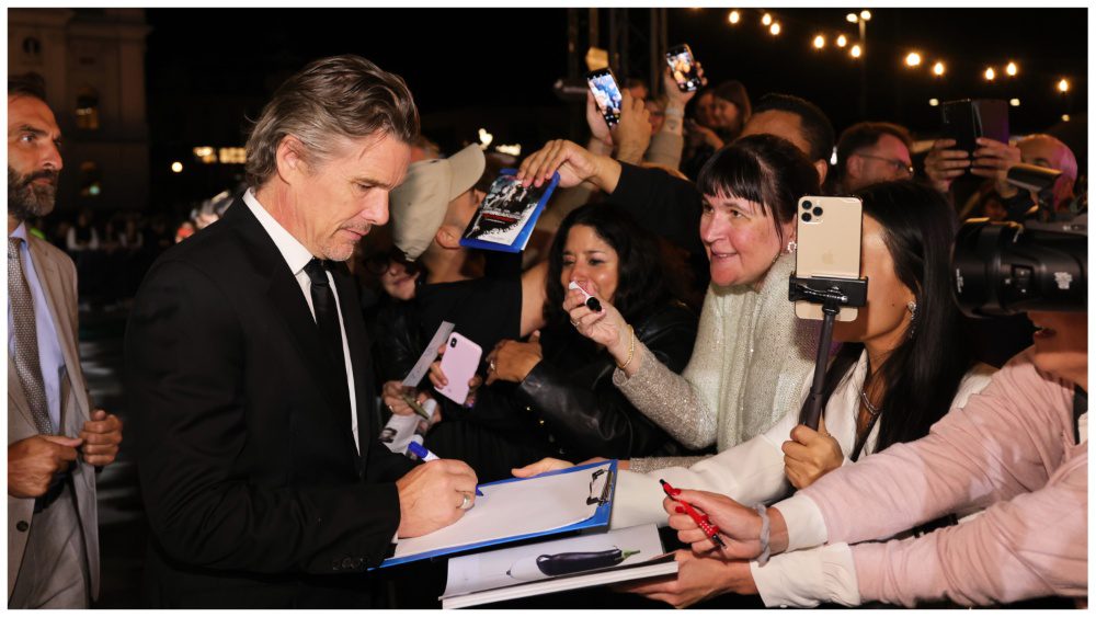 Ethan Hawke signs autographs as he attends the premiere of "Wildcat" during the 19th Zurich Film Festival at Kino Corso on September 30, 2023.