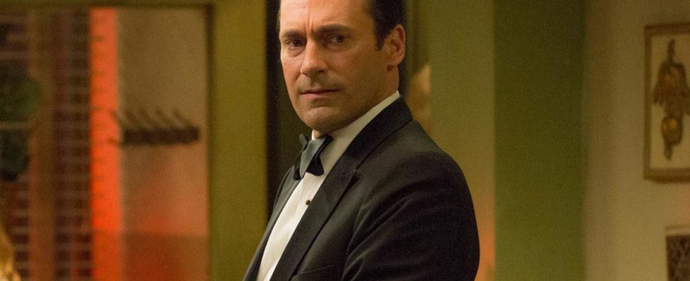 Jon Hamm standing in a tuxedo with a concerned look on his face, in Mad Men.