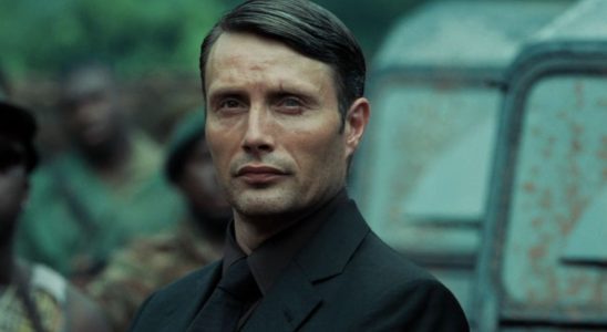 Mads Mikkelsen menacingly stands next to a car in Casino Royale.