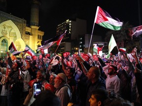 Des Iraniens assistent à un rassemblement à Téhéran pour montrer leur soutien aux Palestiniens, le 7 octobre 2023.