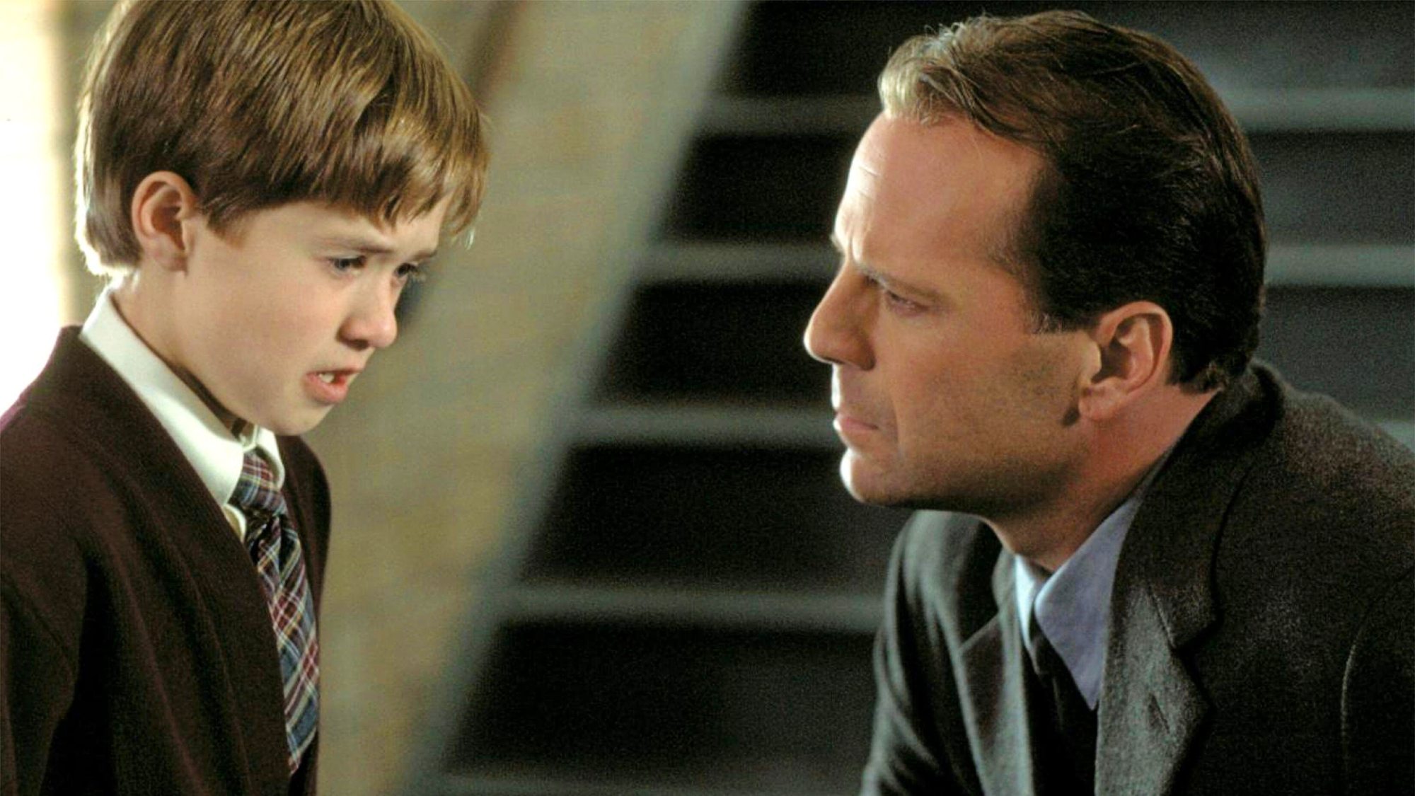 Haley Joel Osment et Bruce Willis dans Le Sixième Sens