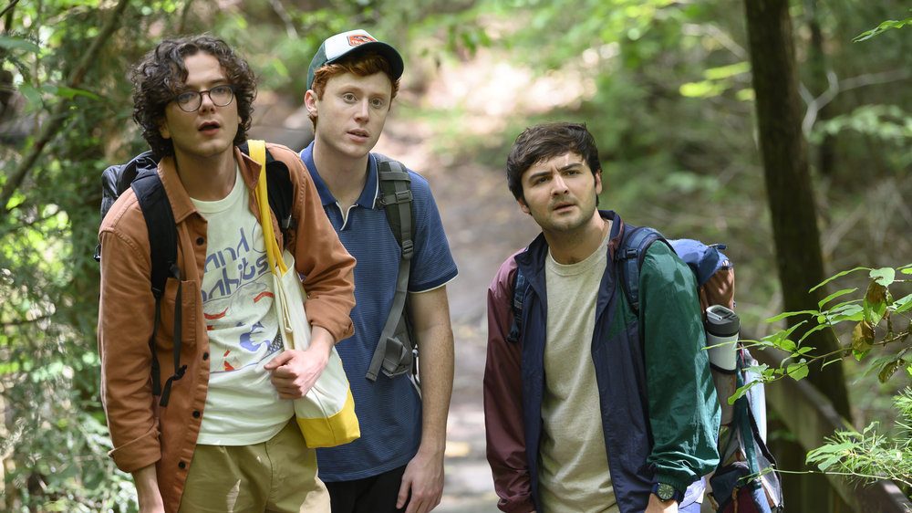 PLEASE DON'T DESTROY: THE TREASURE OF FOGGY MOUNTAIN -- Pictured: (l-r) Martin Herlihy as Martin, Ben Marshall as Ben, John Higgins as John -- (Photo by: Anne Marie Fox/Peacock/Universal Studios)