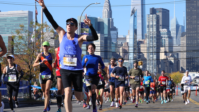 Participants run during the TCS New York City Marathon in New York City, United States on November 07, 2021