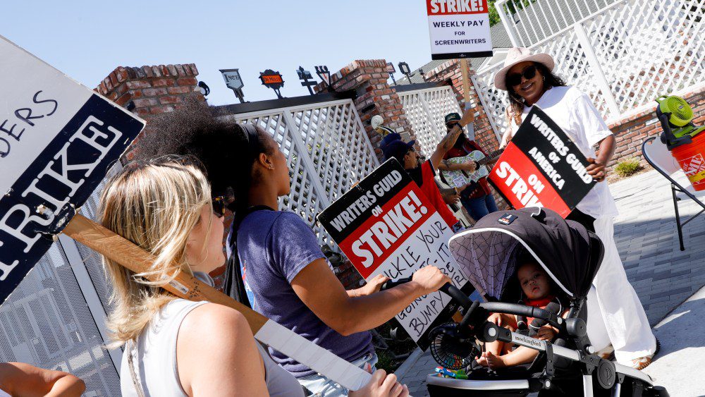 Members of SAG-AFTRA walk the picket line at the SAG-AFTRA and WGA strike at Amazon Studios on August 17, 2023 in Culver City, California. (Photo by River Callaway/Variety via Getty Images)