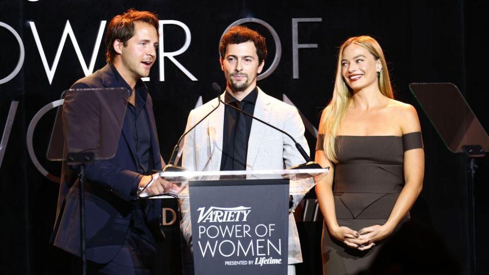 LOS ANGELES, CALIFORNIA - NOVEMBER 16: (L-R) Honorees Tom Ackerley, Josey McNamara, and Margot Robbie speak onstage during Variety Power of Women Los Angeles presented by Lifetime at Mother Wolf on November 16, 2023 in Los Angeles, California. (Photo by Joe Scarnici/Variety via Getty Images)