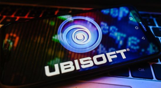 POLAND - 2023/11/09: In this photo illustration a UbiSoft logo is displayed on a smartphone with stock market percentages on a laptop. (Photo Illustration by Omar Marques/SOPA Images/LightRocket via Getty Images)