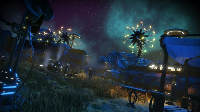 No Man's Sky : une colonie sur une planète au ciel nocturne rempli d'étoiles.