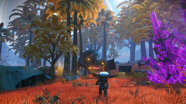 No Man's Sky : un robot sur une planète colorée avec des arbres lumineux.