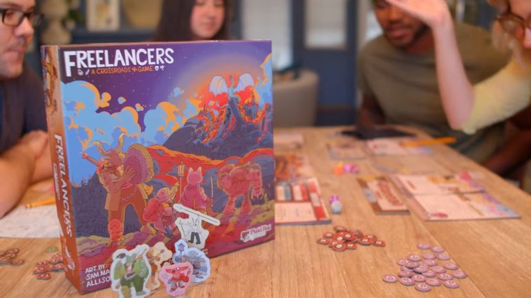 The Freelancers box on a wooden table beside the game board, tokens, and more as people play