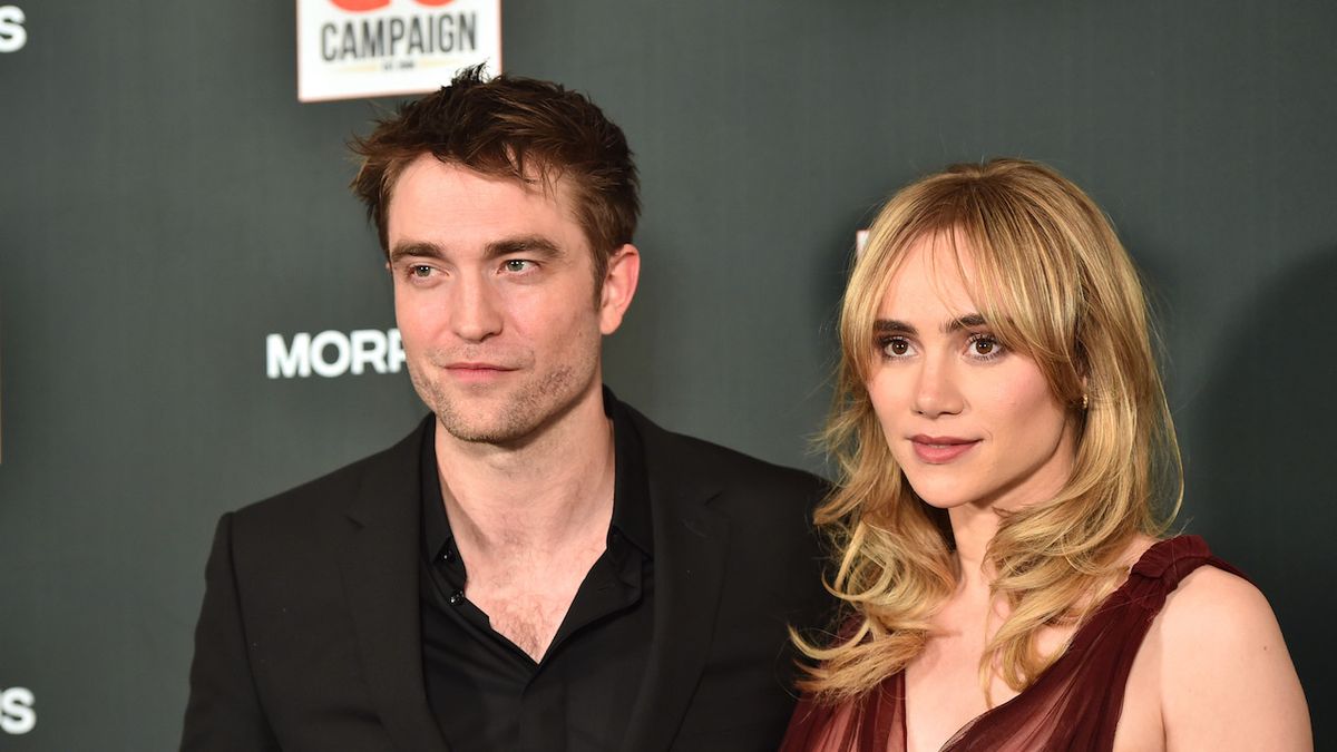 Robert Pattinson and Suki Waterhouse posting on the red carpet