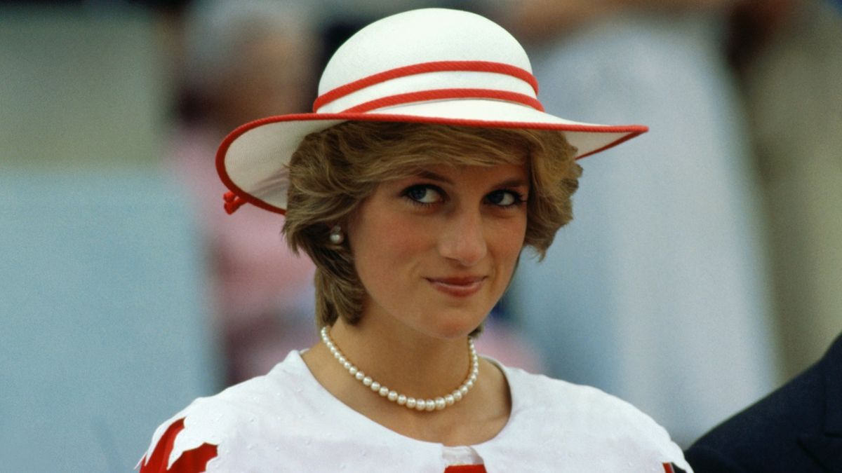 Diana, Princess of Wales, wears an outfit in the colors of Canada during a state visit to Edmonton, Alberta, with her husband