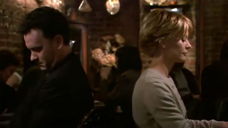 Tom Hanks and Meg Ryan ignore one another at dinner in You