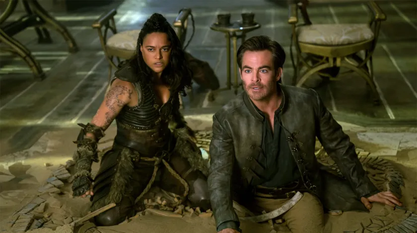 Chris Pine et Michelle Rodríguez glissent sur le sol.  Dungeons Dragons : Honneur parmi les voleurs