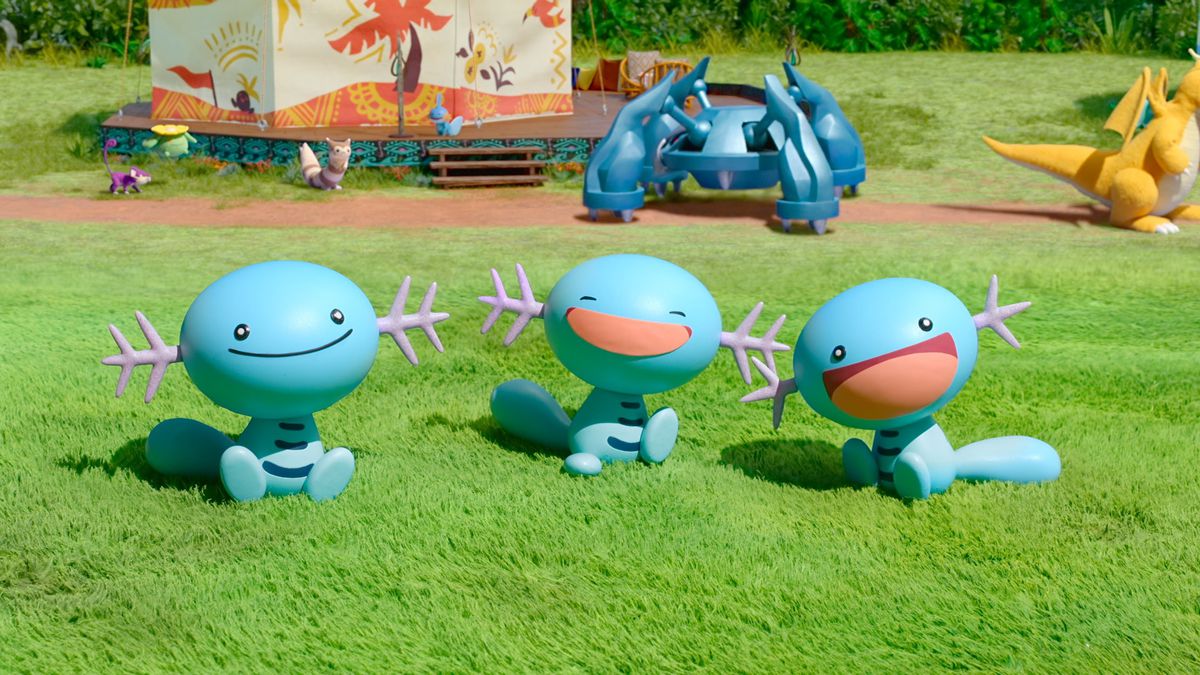 Un trio de Woopers souriants.  Un métalosse est en arrière-plan