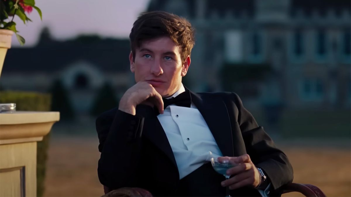 Barry Keoghan as Oliver Quick in a suit outside of Saltburn. 