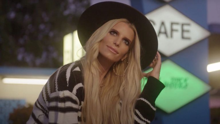 Jessica Simpson wearing a wide-brimmed hat.