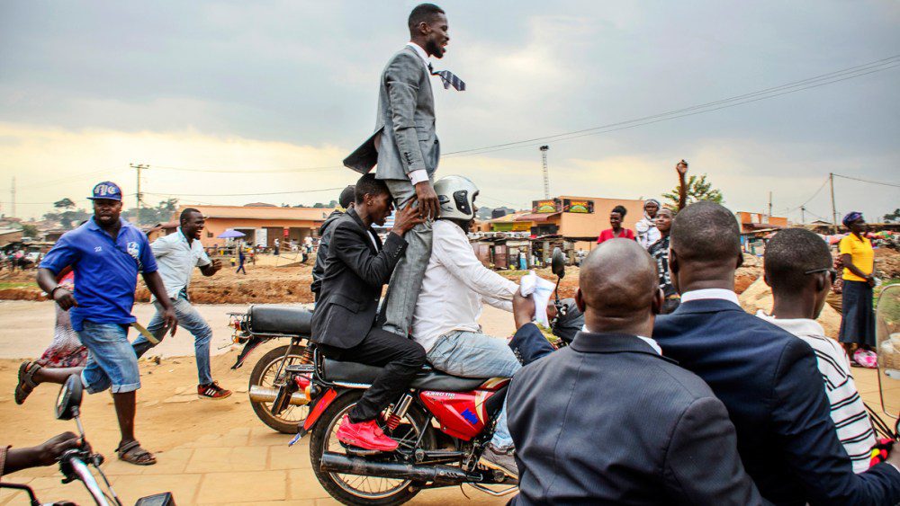 Bobi Wine on Boda boda escaping from Police in Uganda Kampala