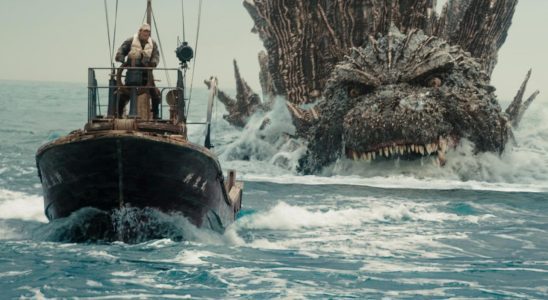 A boat being chased by Godzilla, a giant lizard monster.