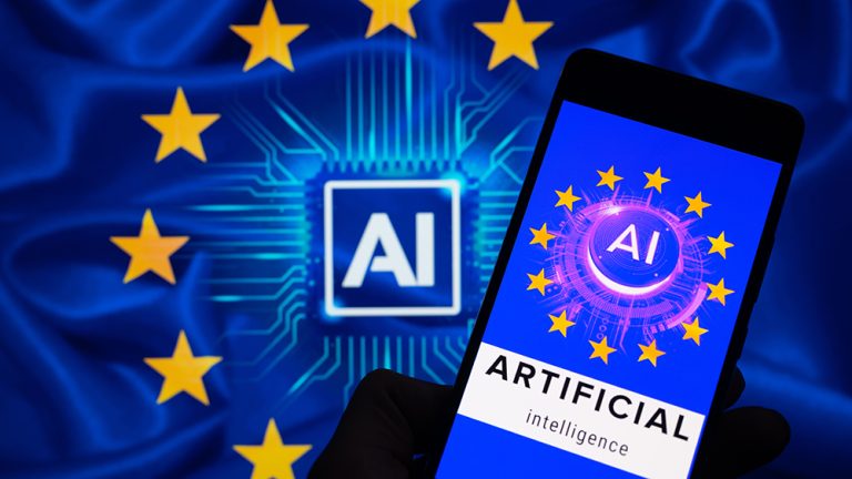 An icon representing Artificial Intelligence is being displayed on a smartphone, with AI and EU stars visible in the background, in this photo illustration. EU policymakers are reaching a political agreement that is poised to become the global benchmark for regulating Artificial Intelligence, in Brussels, Belgium, on December 12, 2023. (Photo by Jonathan Raa/NurPhoto via Getty Images)