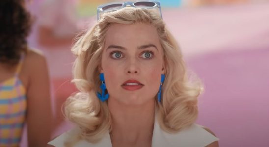 Margot Robbie as Barbie looking shocked.