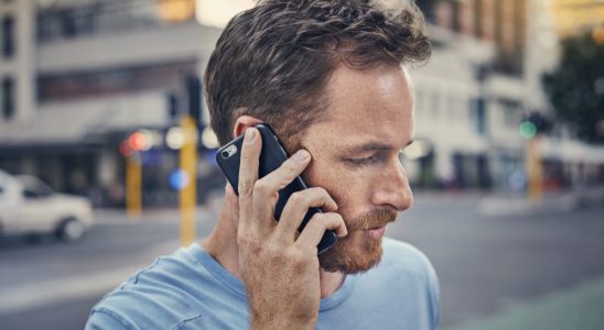 Young man on his phone in the city