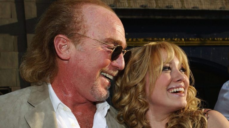 HOLLYWOOD, CA - APRIL 26: Actress Hilary Duff (R) hugs producer Stan Rogow as they attend the premiere of The Lizzie McGuire Movie on April 26, 2003 in Hollywood, California. (Photo by Lucy Nicholson/Getty Images)