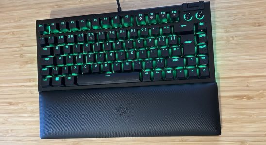 Razer BlackWidow V4 75% keyboard on a wooden desk top