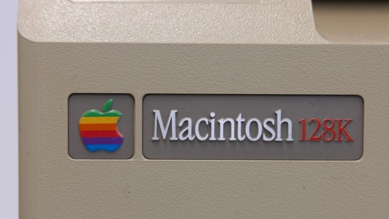 The model badge showing the working memory of 128K of an early Apple Macintosh Model M0001, as they celebrate 40th anniversary, is on display at the independent Apple products store chain Amac, on January 24, 2024 in Utrecht, The Netherlands. Based on the Motorola 68000 microprocessor, the Macintosh was the first successful mouse-driven computer with a graphical user interface.