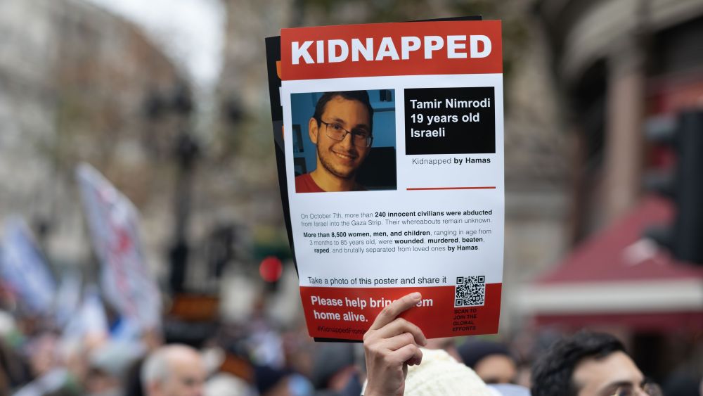 London, UK, November 26 2023, A pro-Israeli protesters holds a placard at the "March Against Antisemitism" in support of hostages taken by Hamas in Gaza. (Photo by: Andy Soloman/UCG/Universal Images Group via Getty Images)