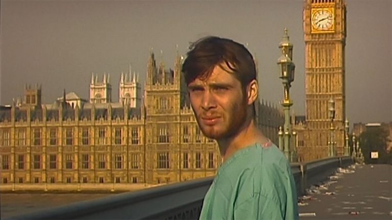 Cillian Murphy stands in front of a desolate London in 28 Days Later.