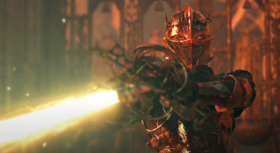 Pieta, a boss from the upcoming Lords of the Fallen game, levels a glowing blade menacingly at the player.