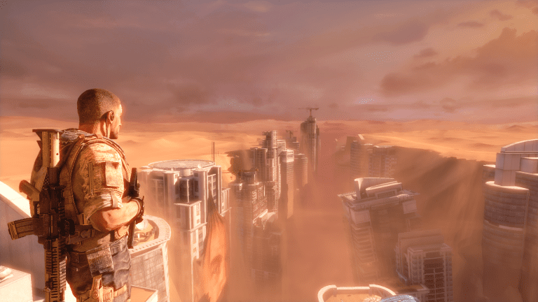 A soldier looks over a sand-blasted city in a screenshot from Spec Ops: The Line.