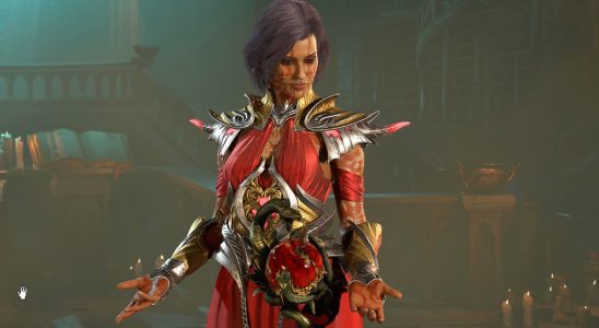 Diablo 4 Sorceress wearing red metallic armor looking down at her hands