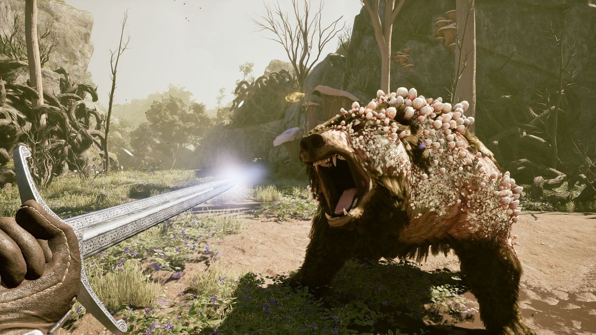 Avowed — the player character faces a plague-ridden bear in combat, pointing their longsword towards the bear as it roars.