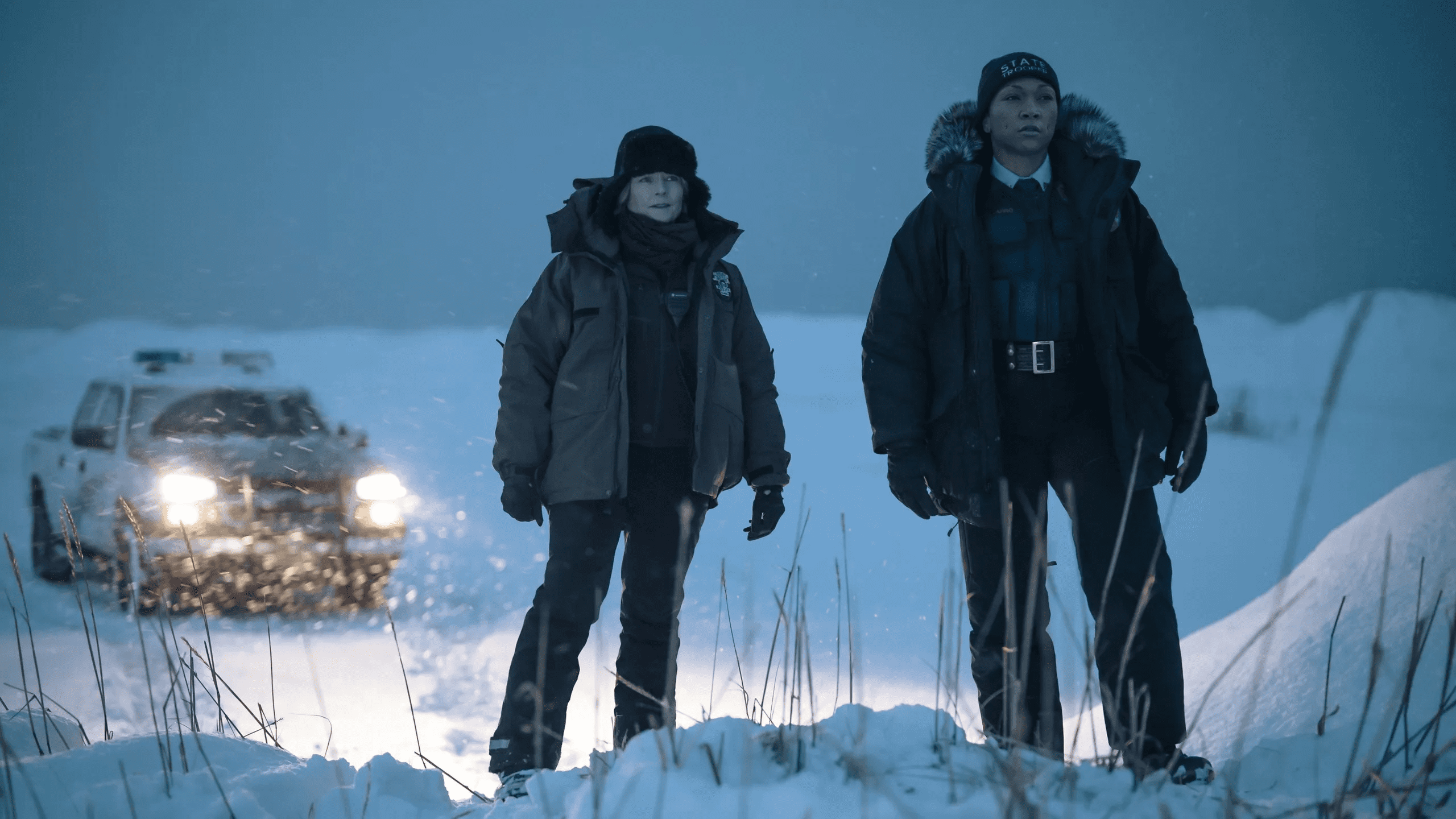 Police detectives Liz Danvers and Evangeline Navarro stand together