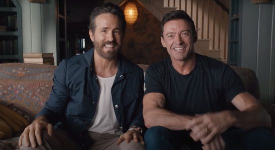 Hugh Jackman and Ryan Reynolds sitting side by side in the Deadpool 3 announcement video