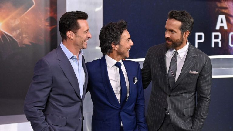 Reynolds, Levy, and Jackman on the red carpet