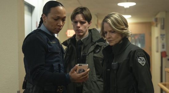 Peter, Danvers and Navarro looking at phone in True Detective: Night Country