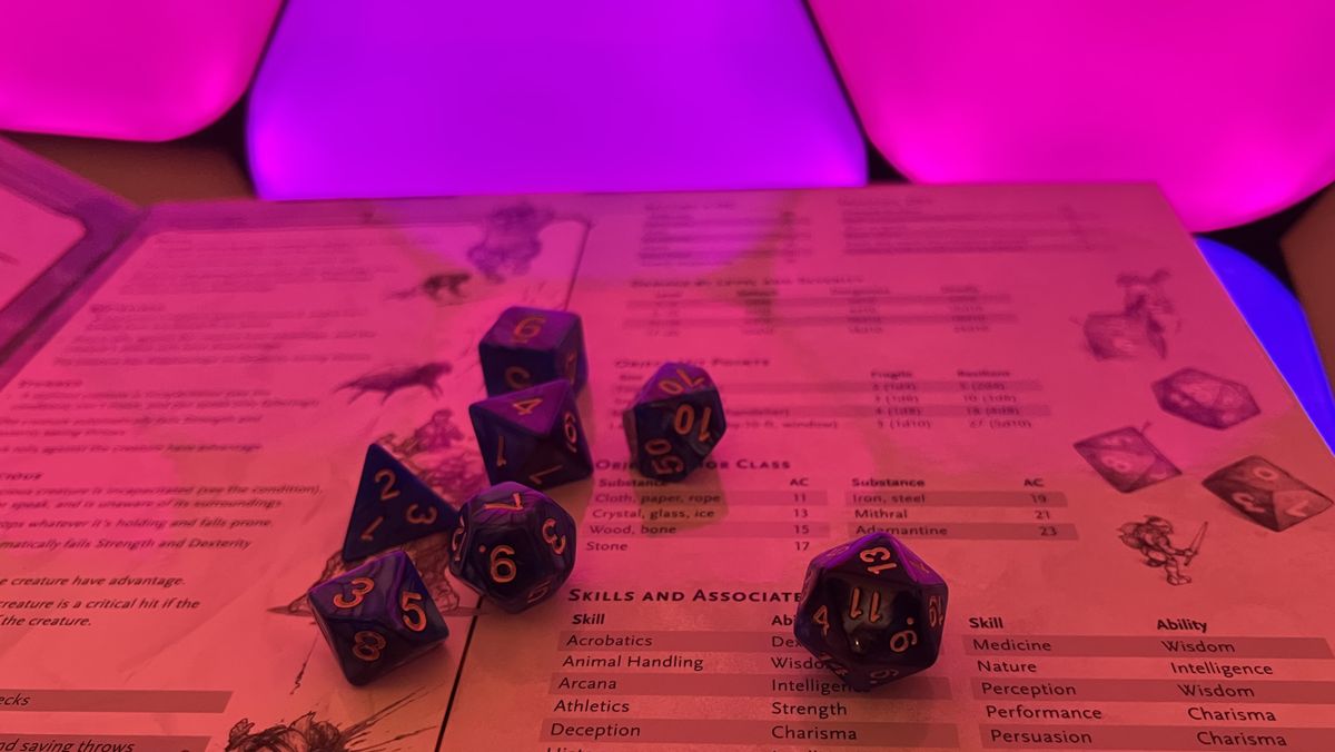 A set of D&D dice on a Dungeon Master