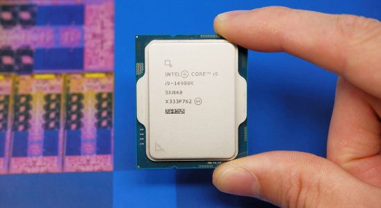 Intel Core i9 14900K CPU on a box and inside a motherboard socket.